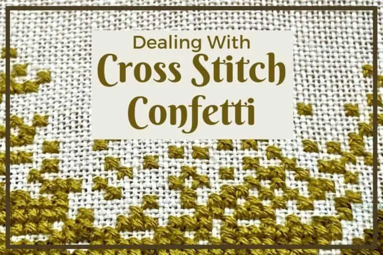 The words "Dealing with Cross Stitch Confetti" in a golden brown color placed over the picture of a cross stitch with random gold and brown stitches all over the fabric, concentrated more at the bottom