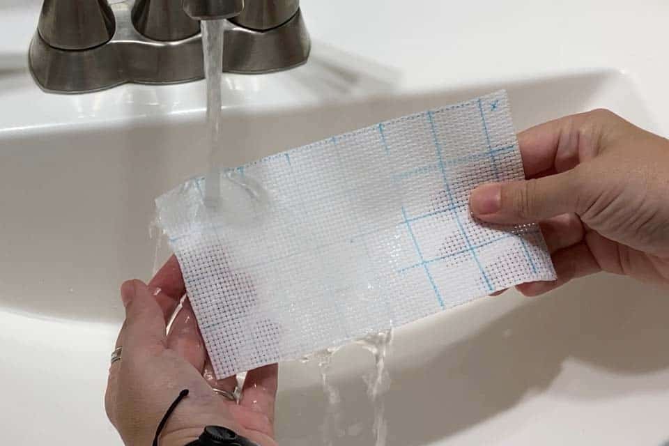 Washing water soluble marker off of aida cloth under an indoor faucet